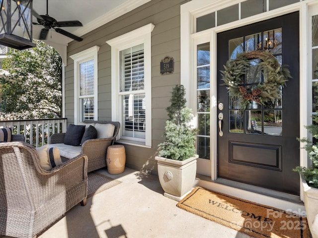 doorway to property featuring ceiling fan and covered porch