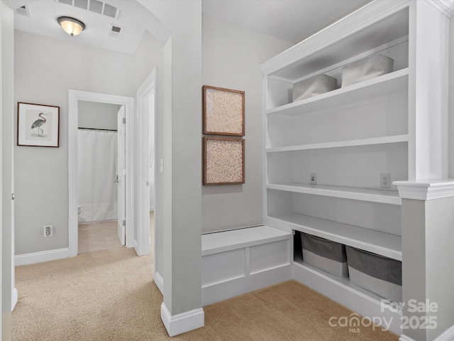 mudroom featuring baseboards, visible vents, and carpet flooring