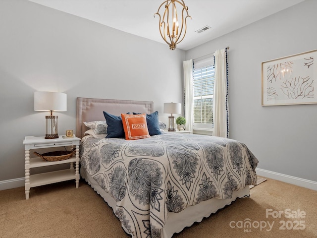 carpeted bedroom featuring visible vents, a notable chandelier, and baseboards