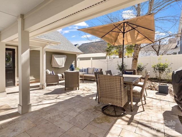 view of patio / terrace with fence, outdoor lounge area, and outdoor dining space