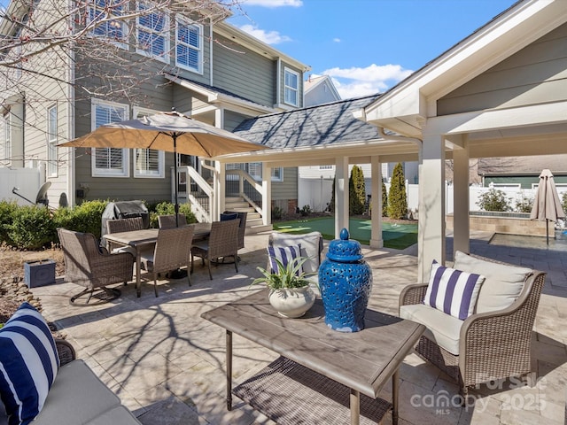 view of patio / terrace featuring outdoor dining space and fence