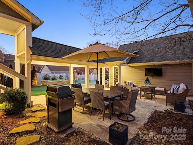 view of patio featuring outdoor dining space, fence, an outdoor living space, and an outdoor pool