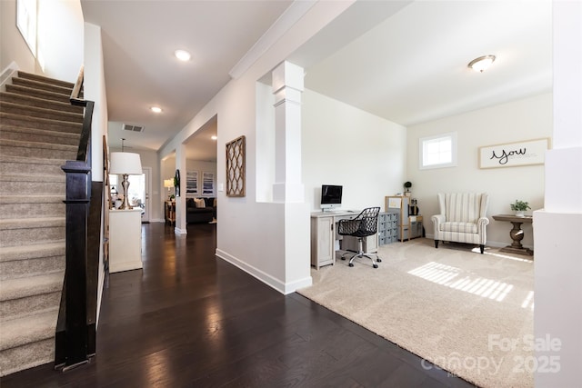 office area with baseboards, visible vents, wood finished floors, ornate columns, and recessed lighting