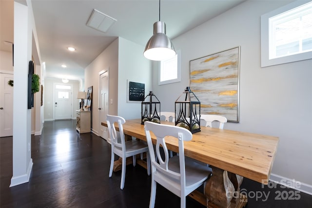 dining space featuring dark wood-style floors, visible vents, baseboards, and recessed lighting