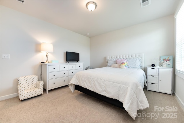 bedroom featuring visible vents, light carpet, and baseboards