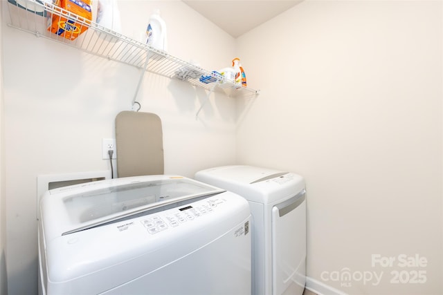 laundry room with laundry area and washer and clothes dryer