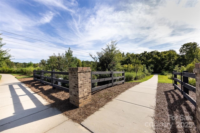 view of gate featuring fence