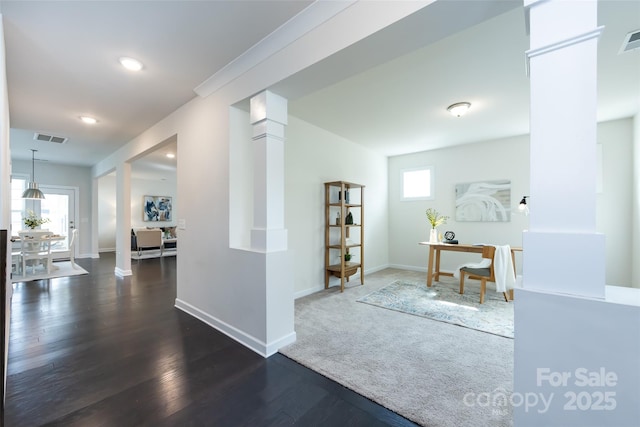 interior space featuring visible vents, baseboards, recessed lighting, and wood finished floors