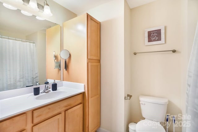 bathroom with vanity and toilet