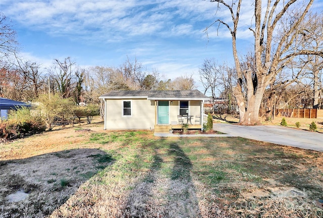 exterior space with an outdoor structure and fence