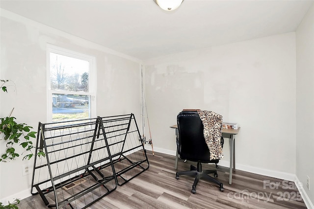 home office with wood finished floors and baseboards