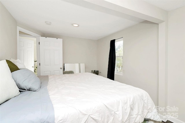 bedroom featuring recessed lighting