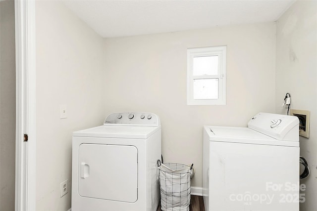 laundry area with laundry area and independent washer and dryer