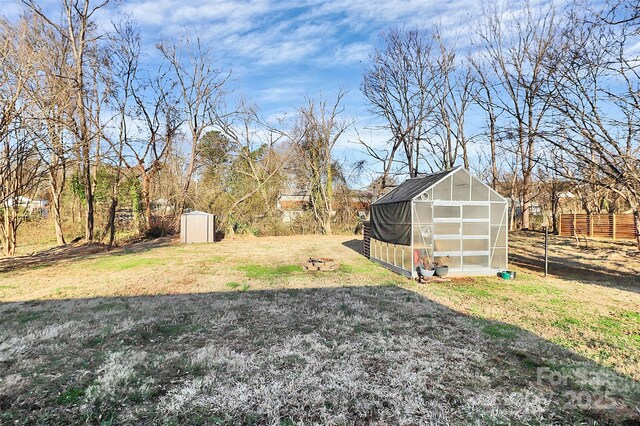 view of yard with an outdoor structure and an exterior structure