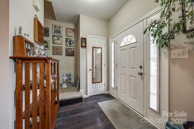 entrance foyer featuring dark wood finished floors