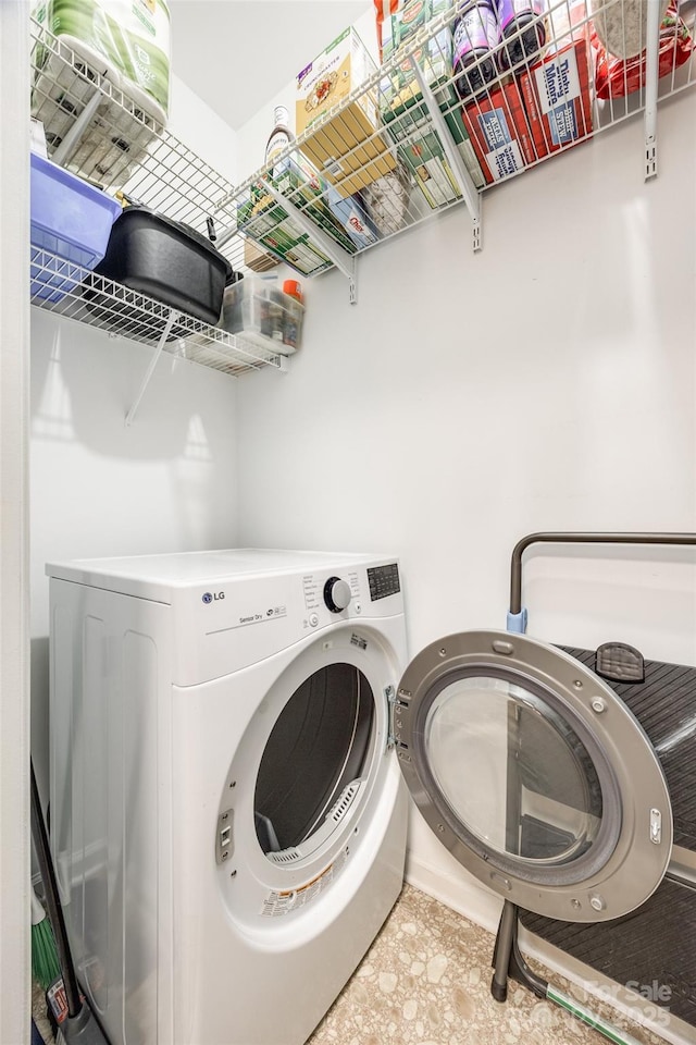 laundry area with washer / dryer and laundry area