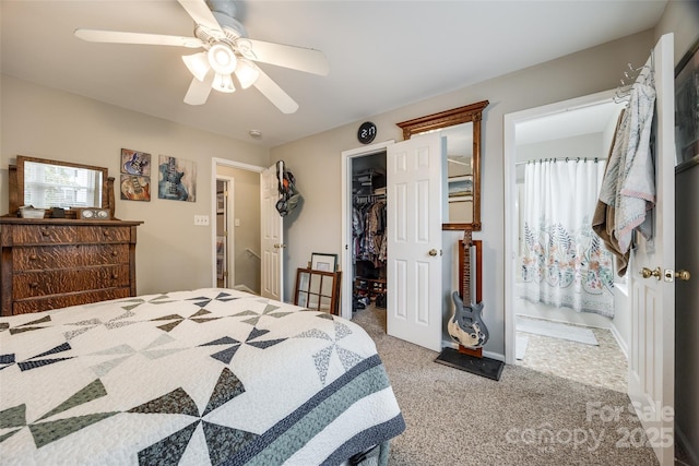 bedroom with ceiling fan, carpet flooring, baseboards, a spacious closet, and a closet