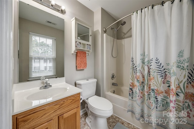 full bath with toilet, shower / tub combo, visible vents, and vanity