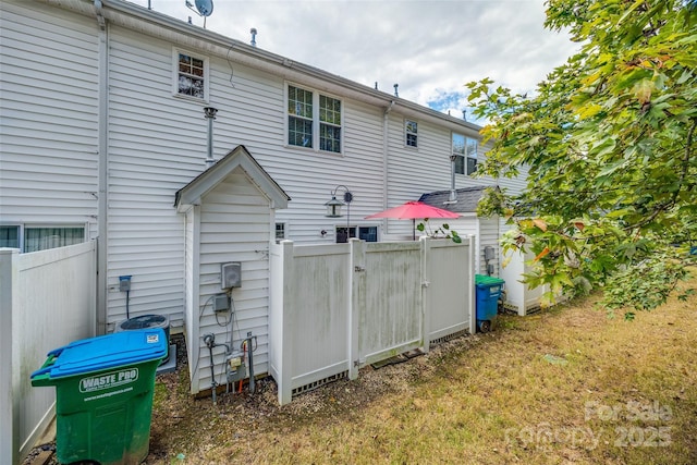 back of property with fence