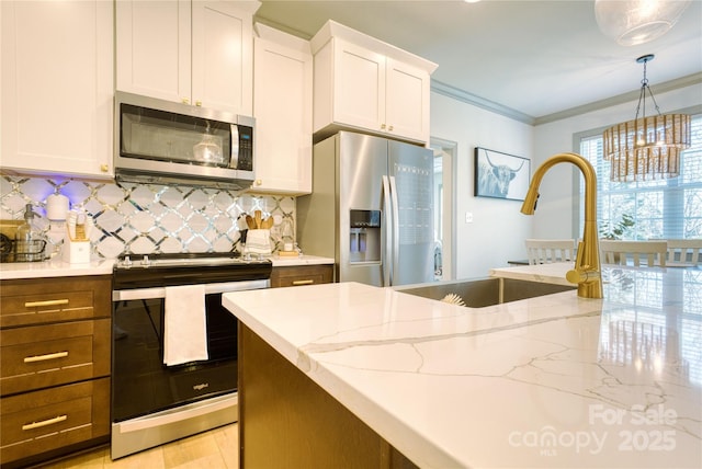 kitchen featuring backsplash, crown molding, appliances with stainless steel finishes, an inviting chandelier, and a sink