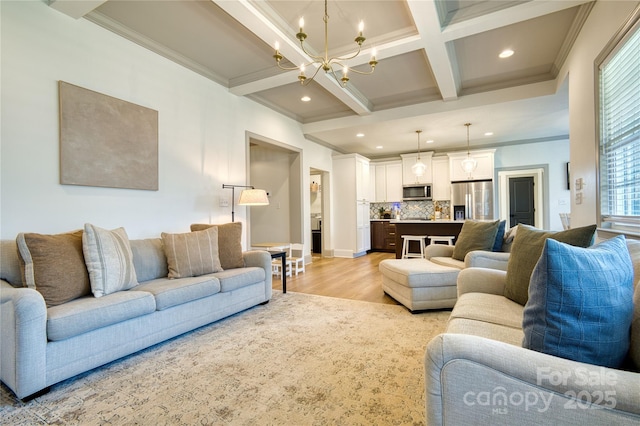 living room featuring coffered ceiling, beam ceiling, light wood-style flooring, ornamental molding, and a notable chandelier