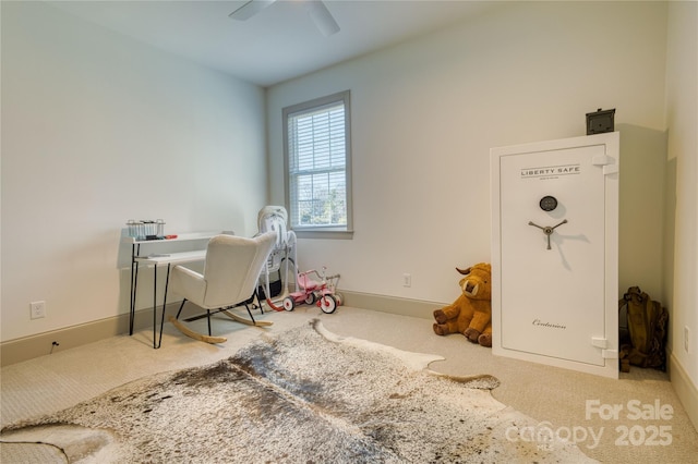 home office featuring baseboards, a ceiling fan, and carpet floors