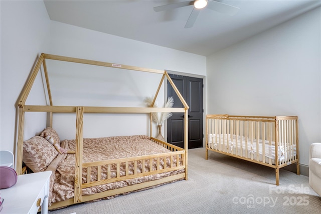 bedroom with ceiling fan and carpet flooring