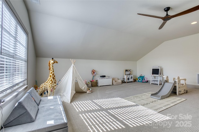 rec room with plenty of natural light, carpet floors, a ceiling fan, and vaulted ceiling