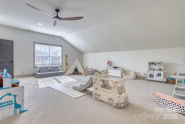 rec room featuring lofted ceiling, a ceiling fan, visible vents, and carpet floors