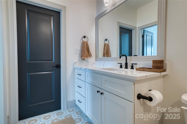 bathroom with toilet and vanity