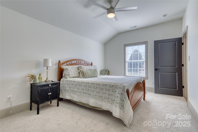 bedroom with visible vents, baseboards, light colored carpet, vaulted ceiling, and a ceiling fan