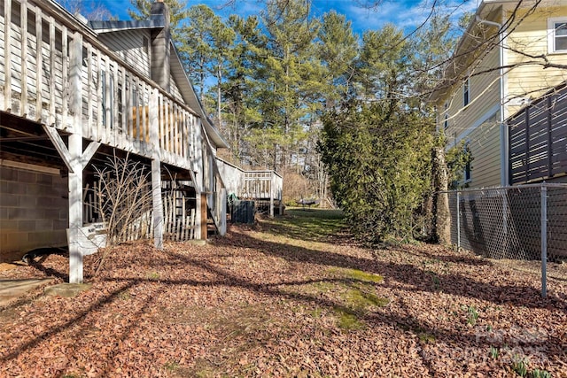 view of yard featuring a wooden deck and stairs