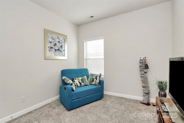 sitting room featuring carpet, visible vents, and baseboards