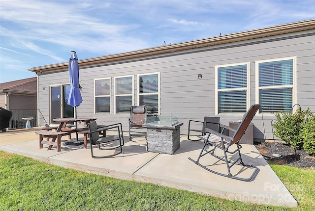 view of patio / terrace featuring an outdoor fire pit