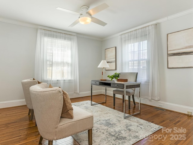 office with visible vents, ornamental molding, and hardwood / wood-style floors