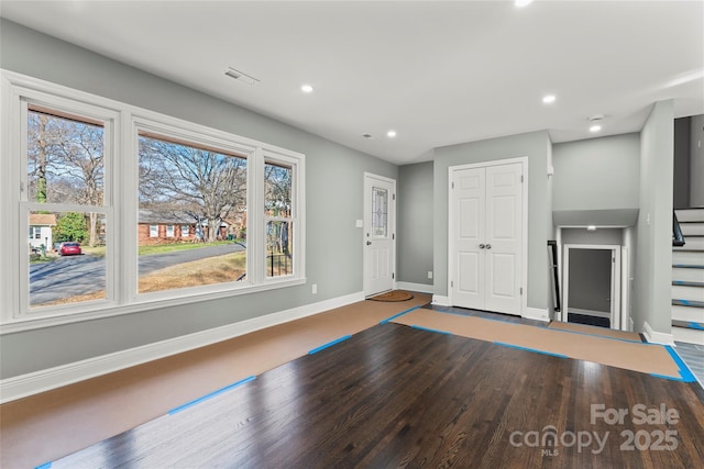 entryway featuring stairs, recessed lighting, and baseboards