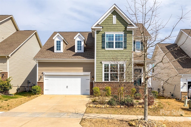 view of front of home featuring concrete driveway, brick siding, a garage, and roof with shingles