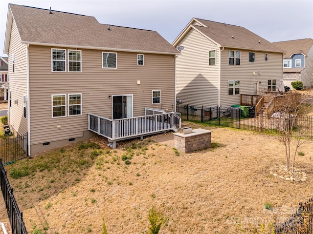 back of property featuring crawl space, a deck, and a fenced backyard