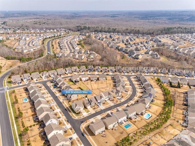 birds eye view of property with a residential view