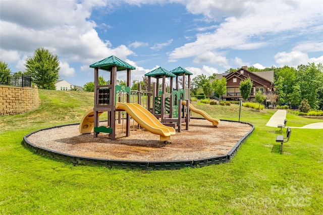 communal playground featuring a yard