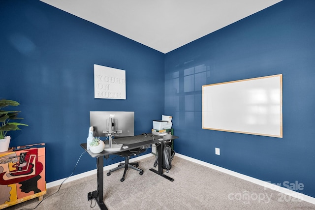 home office with carpet floors and baseboards