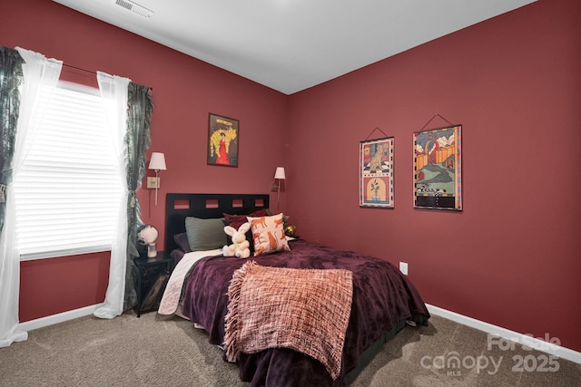 bedroom with carpet, visible vents, and baseboards