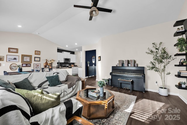 living area with dark wood-style floors, recessed lighting, vaulted ceiling, and baseboards