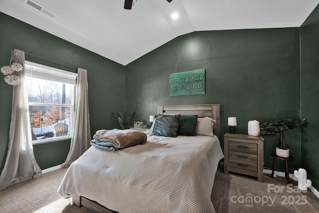 bedroom with lofted ceiling, ceiling fan, carpet flooring, visible vents, and baseboards