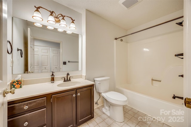 full bath with vanity, visible vents, a textured ceiling, bathing tub / shower combination, and toilet