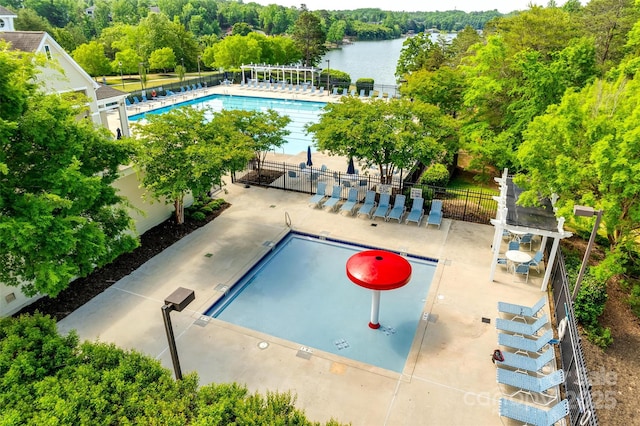 pool with a pergola, fence, and a water view