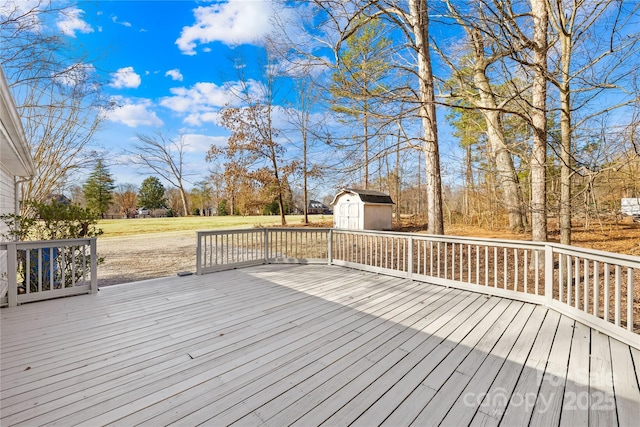 deck with a storage shed and an outdoor structure