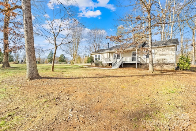 view of yard with a wooden deck