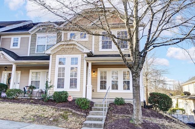 view of front of house featuring a porch and a shingled roof