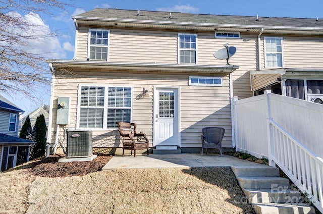 back of house featuring fence, cooling unit, and a patio